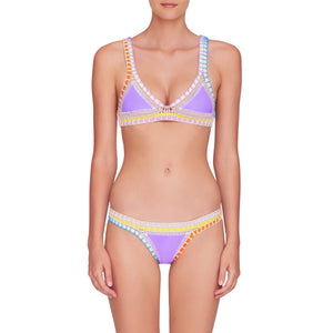front image of lavender color kiini bikini top and bottom with multi color crochet elastic trim on model